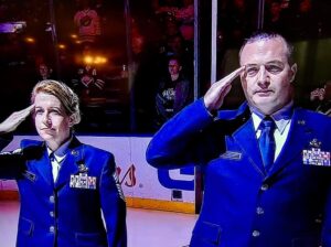 Jennifer standing on the ice for the national anthem prior to a Buffalo Sabres game. 