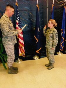 Jennifer in uniform being sworn in,